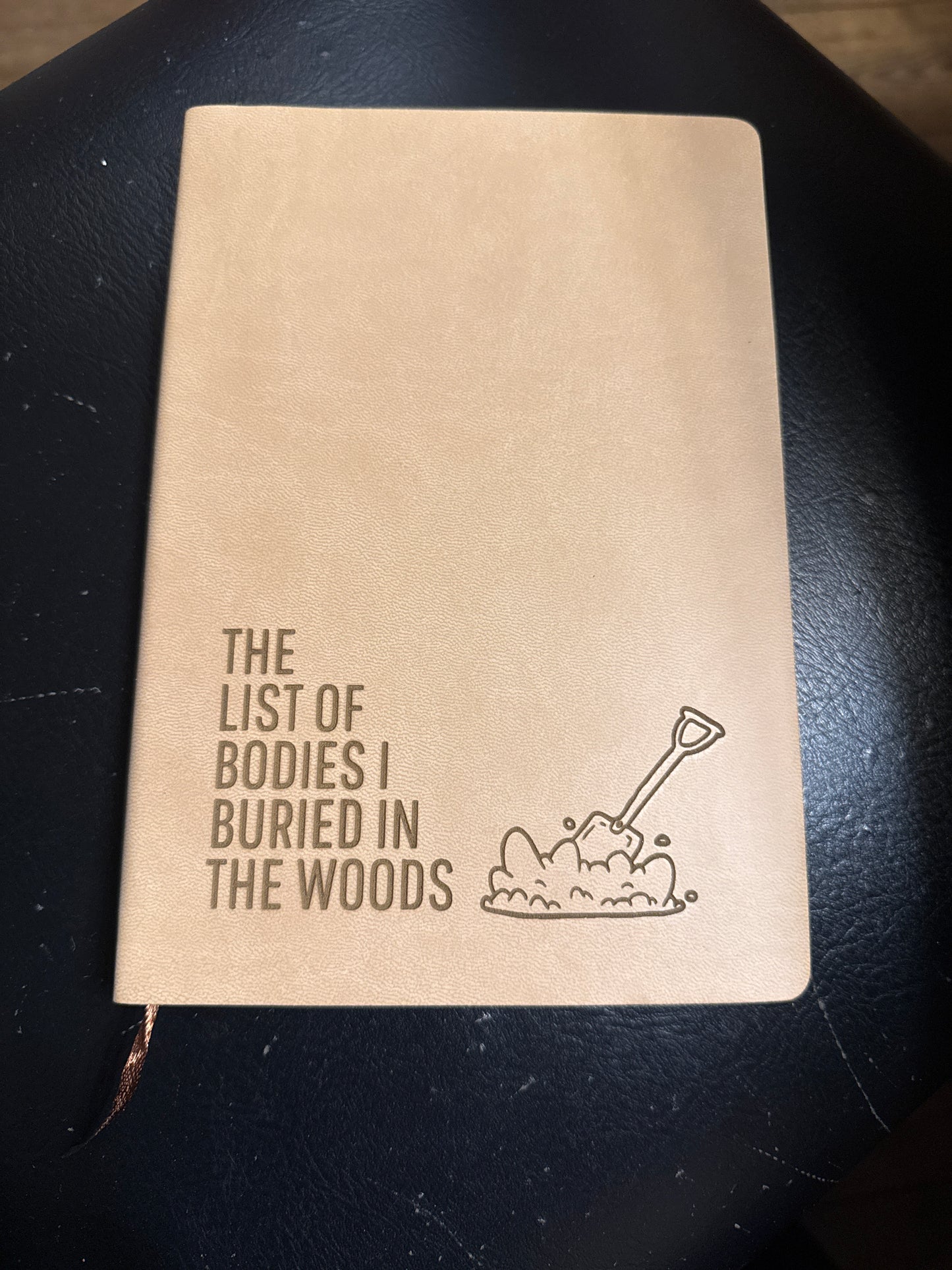 “Bodies buried in the woods" Leather Journal