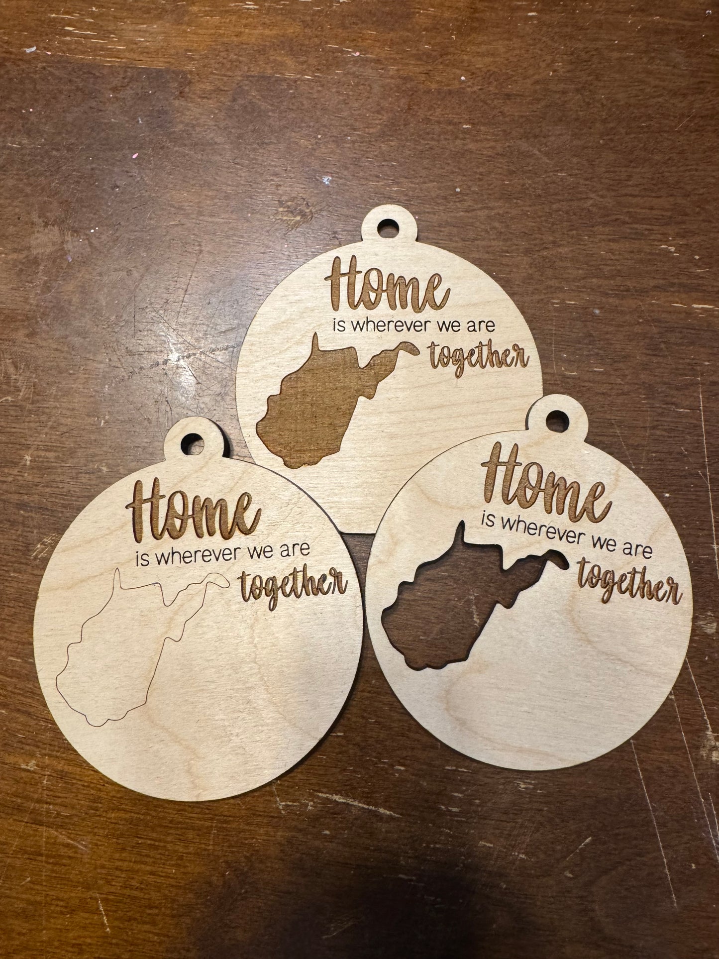 "Home is where we are together" state ornaments